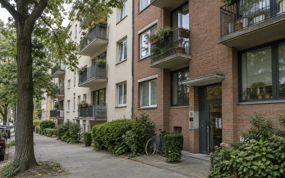Occupied apartment buildings along a residential street.